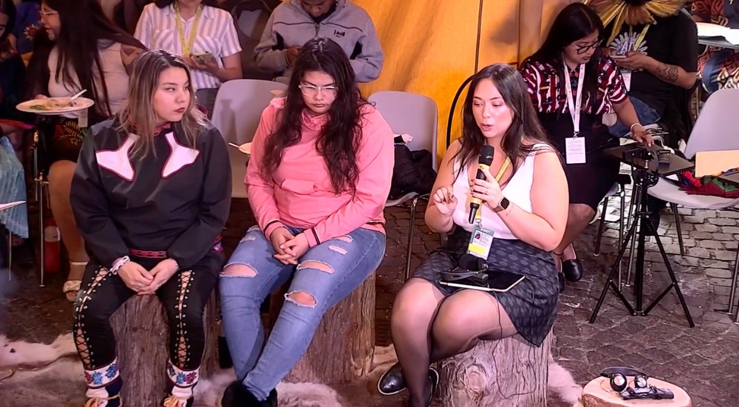  In the picture Jessica Penney from the Arctic, is sharing her message to academic institutions to recognize Indigenous peoples as leaders and researchers. Natalie Noksana and Jeannie Gruben are also in the picture. 